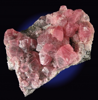 Rhodochrosite on matrix from Uchucchacua Mine, Oyon Prov., Lima Dept., Peru [db_pics/pics/rhodochrosite4b.jpg]
