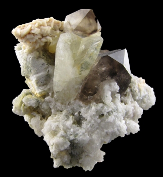 Amblygonite with Smoky Quartz and Feldspar from Telirio Mine, Divina das Laranjeiras, Minas Gerais, Brazil [db_pics/pics/amblygonite1a.jpg]