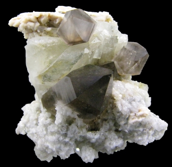 Amblygonite with Smoky Quartz and Feldspar from Telirio Mine, Divina das Laranjeiras, Minas Gerais, Brazil [db_pics/pics/amblygonite1c.jpg]